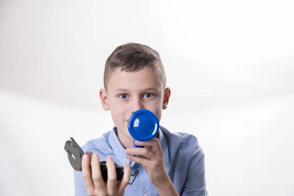 Boy Explains Way Blue Megaphone Compass Hand White Background — Stock Photo, Image