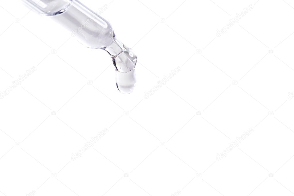 waterdrop with little waves from a pipette