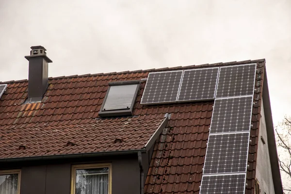 Photovoltaic system on a roof versus chimney heating in bad weather