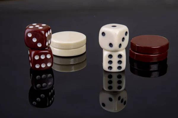 Dice game with dice and game pieces from backgammon