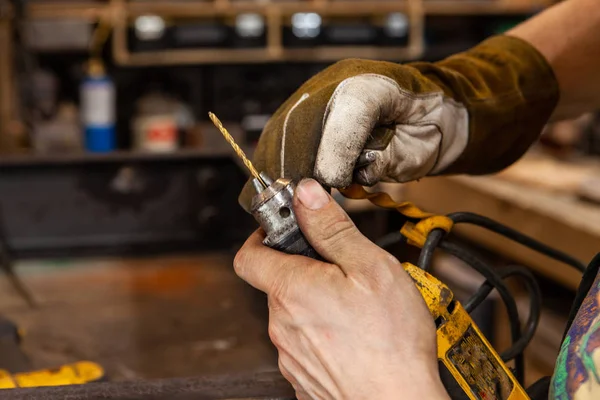 Blacksmith changing a drill bit