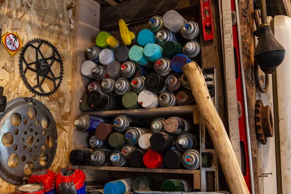 Aerosols stored on shelves in garage — Stock Photo, Image