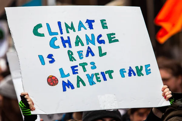 Ecological demonstrators hold banner — Stock Photo, Image