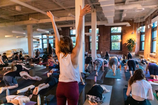 Diverse group of people in yoga class.