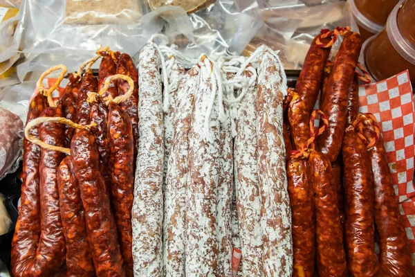 Variety of prepared meats in butchers fridge