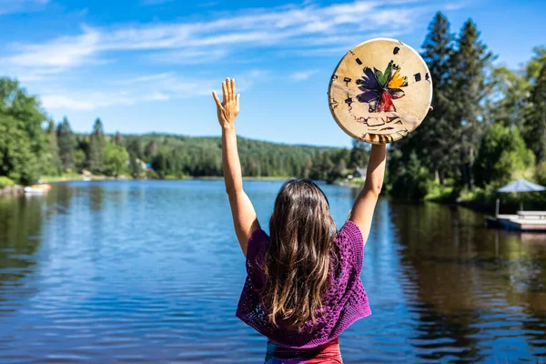 A womans ritual lakeside dance