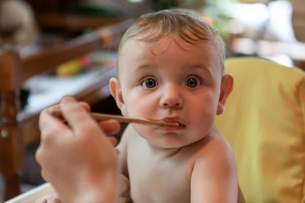 Portrait of a baby being fed — Stock Photo, Image