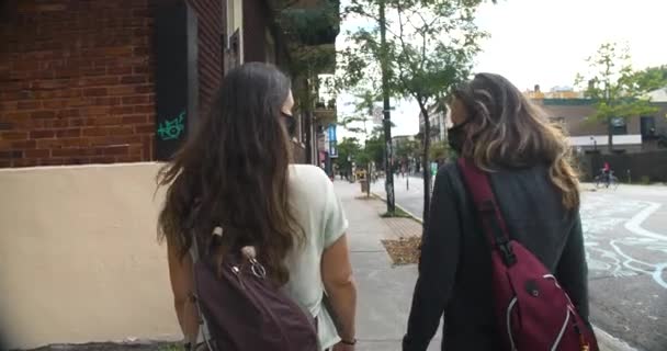 Women with mask walking and talking outdoors — Stock Video