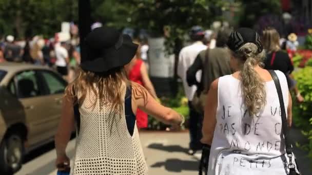 Woman with pram walking on road during rally — Stock Video