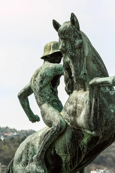 Statue of a man with a horse in the park of Budapest. Sightseeing of Hungary.