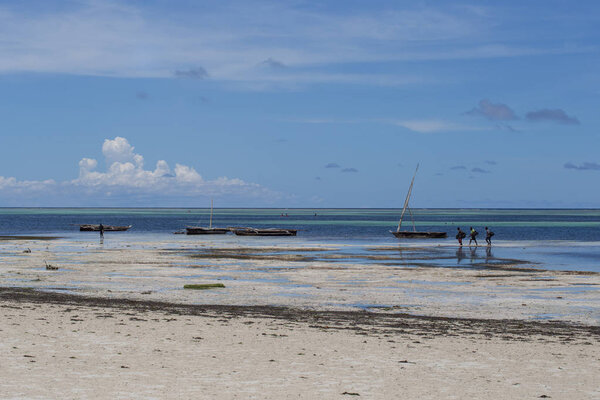 2018.02.21, Kiwengwa, Tanzania. An old boat on the coastline on background of horizon line. Travel around Tanzania.