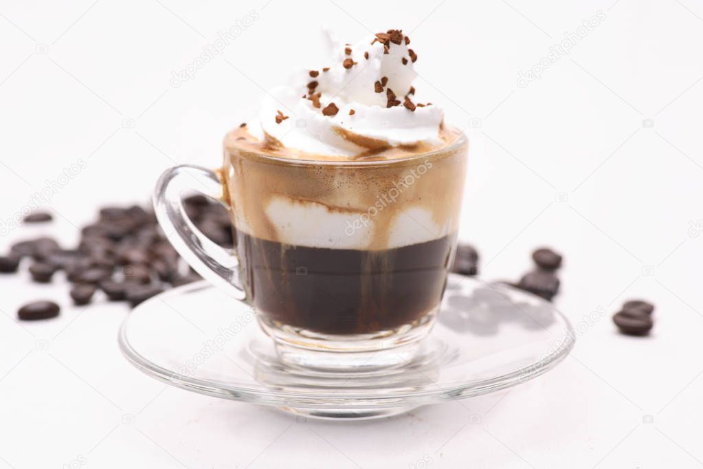 hot Espresso Con Panna coffy in a clear glass on a white background with coffee beans.in studio.