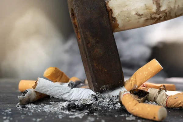 The World No Tobacco Day falls on May 31 of every year.Smoke cigarettes were smashed, destroyed by an iron hammer.Smoking stop concept Eliminate smoking.vintage tone.