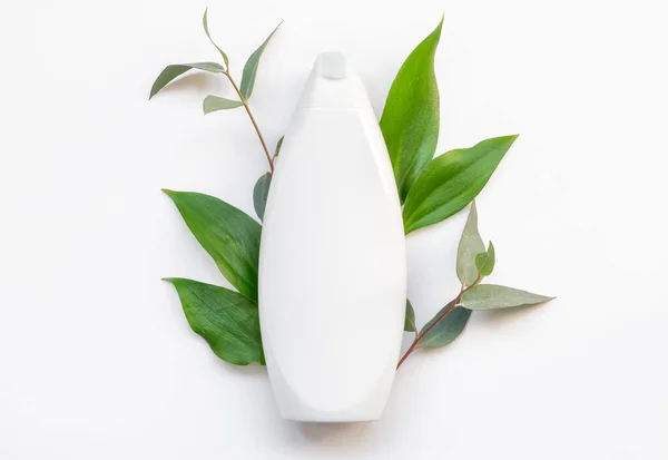 Natural organic cosmetic packaging plastic mock up with leaves. Mock-up bottle for branding. — Stock Photo, Image