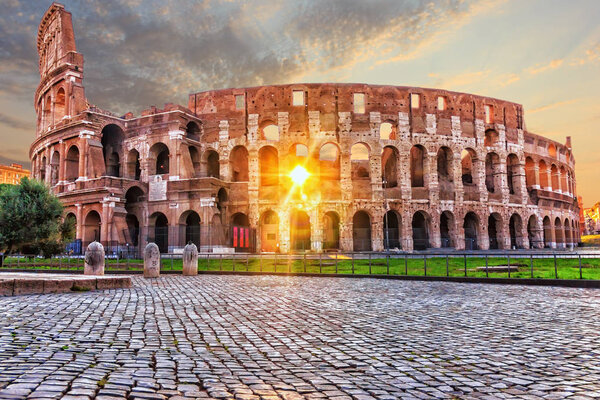 The Coliseum in Rome at sunset, no people.