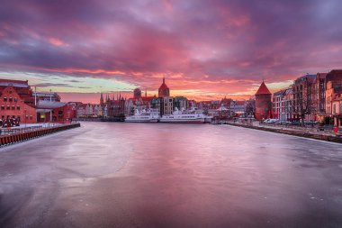Gdansk sunset on the Motlawa river, Poland, winter view. clipart