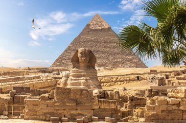 Egyptian pyramids: the Great Sphinx and the Pyramid of Khafre clipart