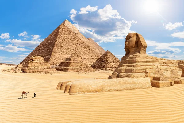 The Pyramids and the Sphinx in the sunny desert of Giza, Egypt Stock Image