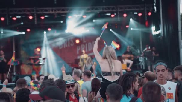 Young Woman Shoulders Music Festival Waving Lgbt Rainbow Flag Pride — Stock Video