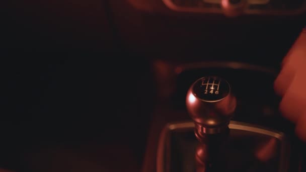 Car Interior Shifting Changing Gear Stick In Manual Car Close Up Night Time With Street Lights