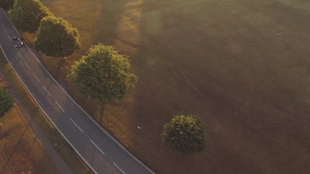 Single Car Driving Road Countryside Sunrise Golden Hour — Stock Video