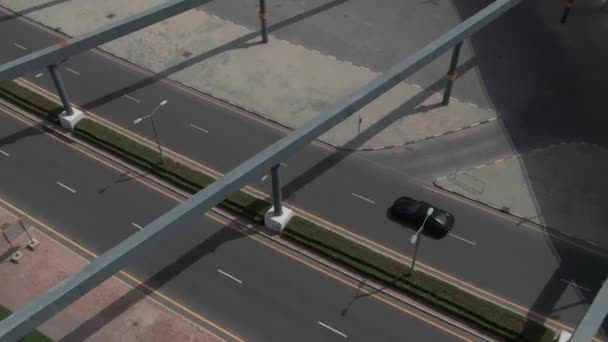 Camera Follows Black Sport Car Crossing Road Junction Meydan Dubai — Stock Video