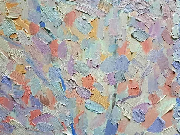 Paint strokes and texture of oil paint on canvas, background of multi-colored strokes