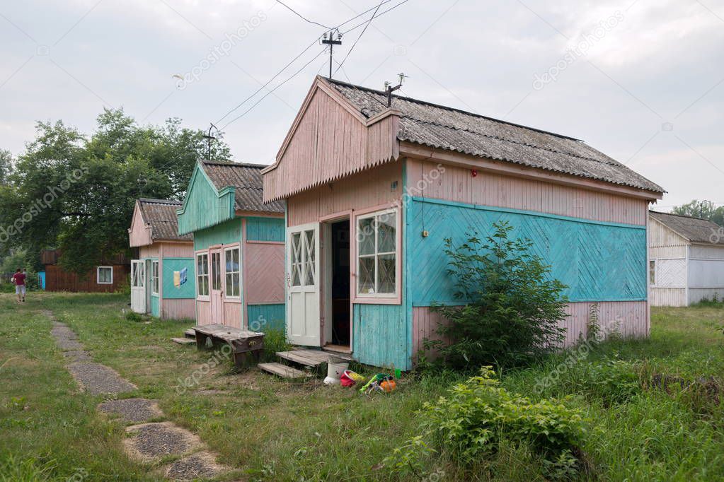 Wooden summer tourist houses at the Iskra camp site in the village of Shushenskoye in the Krasnoyarsk Territory. Russia.