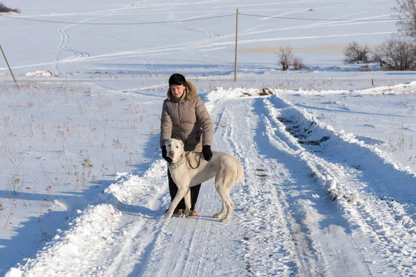 Woman Central Asian Shepherd Dog Stands Winter Rural Road Background — Stock Photo, Image
