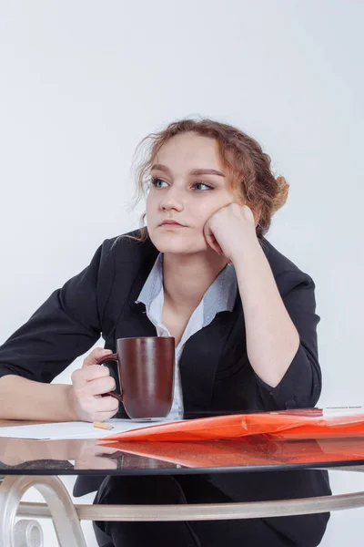 Tired woman feeling pain after sedentary computer work in uncomfortable posture or office chair, exhausted female student or employee leaned on the table, sitting at workplace