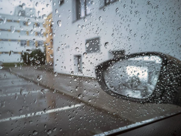 Blurry raindrop and mirror car — Stock Photo, Image