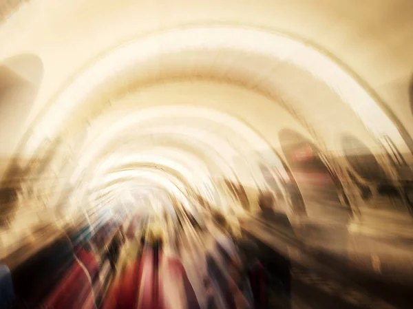 Silhouettes in  tunnel,  towards the light.