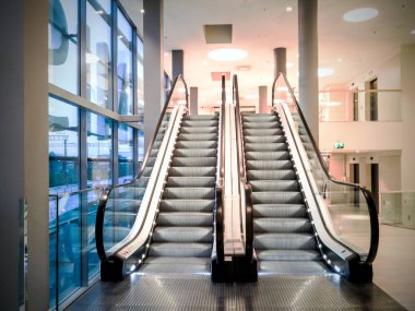  Escalators at the modern shopping  clipart