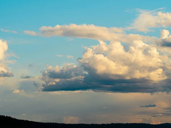 The Baltic Sea at sunset, stormy dramatic clouds. Sunset and dark clouds after storm. The Vacation, summer concept