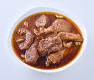 Koyun Kavurma, lezzetli et suyu veya kalın koyun etli sosu ve Hint baharat ve otlar pişmiş.