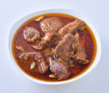 Koyun Kavurma, lezzetli et suyu veya kalın koyun etli sosu ve Hint baharat ve otlar pişmiş.