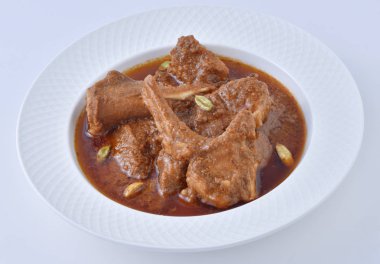 Koyun Kavurma, lezzetli et suyu veya kalın koyun etli sosu ve Hint baharat ve otlar pişmiş.