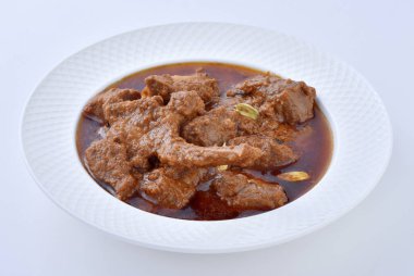 Koyun Kavurma, lezzetli et suyu veya kalın koyun etli sosu ve Hint baharat ve otlar pişmiş.