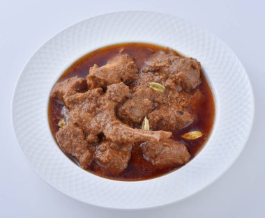 Koyun Kavurma, lezzetli et suyu veya kalın koyun etli sosu ve Hint baharat ve otlar pişmiş.