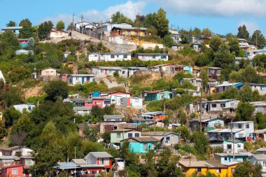 Poor houses on the hills of a small town named Tome, Bio Bio Region, Chile clipart