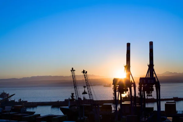 silhouette view of cranes at port facilities at dawn, Valparaiso, Valparaiso Region, Chile, South America