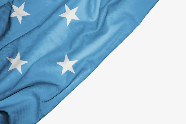 Flaga Mikronezji tkaniny z miejsce dla tekstu na białym — Zdjęcie stockowe