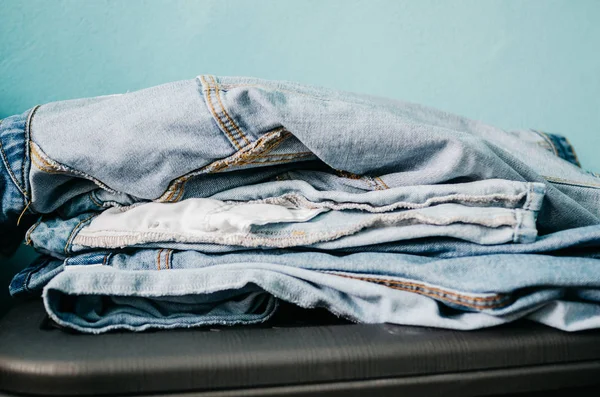 Denim clothes in a pile — Stock Photo, Image