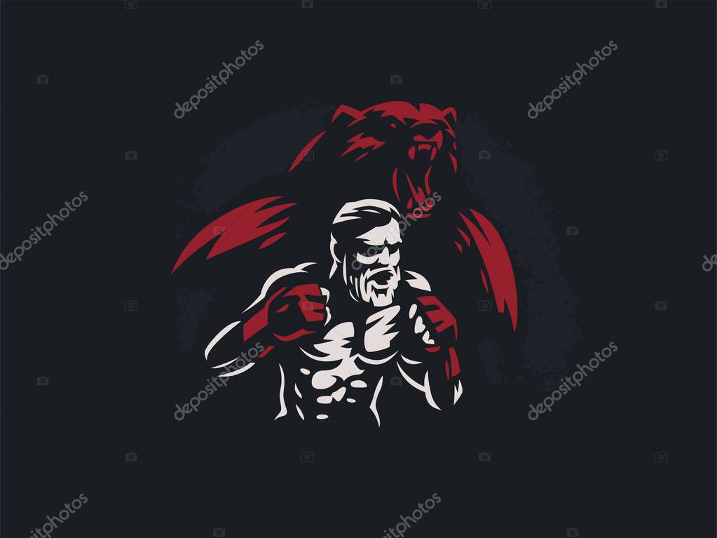 Fighter mixed martial arts is in combat stance. Against the backdrop of the silhouette of a bear.