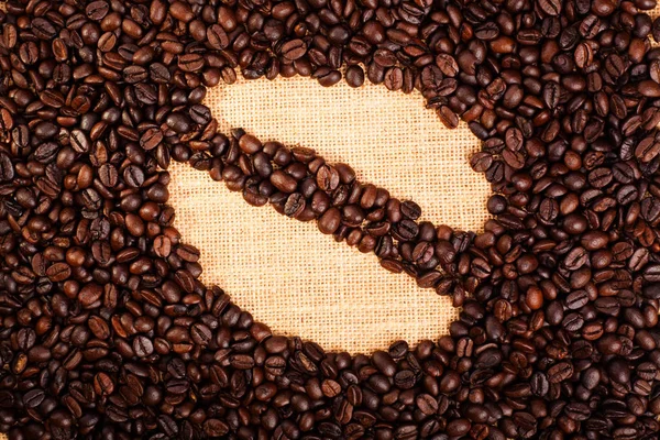 Coffee beans icon shape with burlap background made from roasted coffee bean