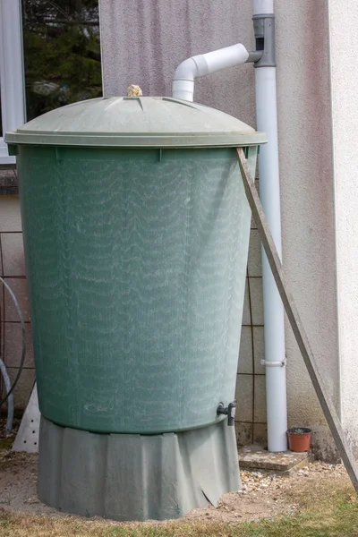 Close up on Green recovery of rainwater in a garden