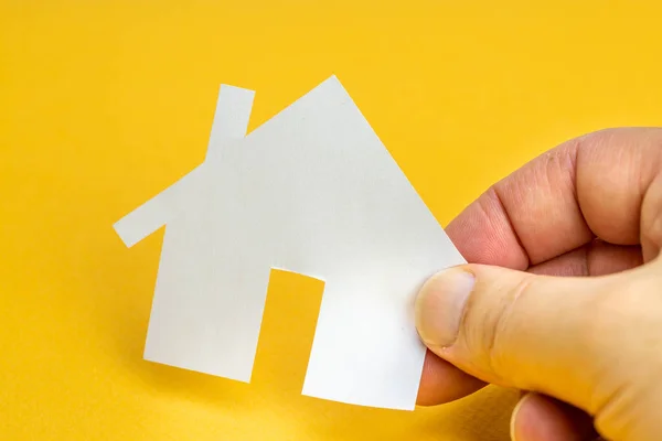 Hand Holding Paper House Yellow Background Real Estate Concept — Stock fotografie