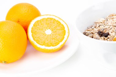 Delicious balanced breakfast with a bowl of muesli and fresh orange juice