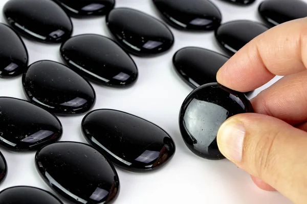 Black Pebbles White Background Brown Pebble Concept Diversity Singularity — Stock Photo, Image