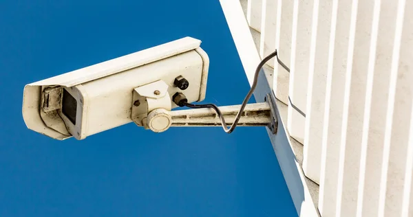 Modern CCTV camera on the wall of an industrial building — Stock Photo, Image